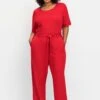 Jumpsuit Mit Bindegürtel Und Weitem Bein